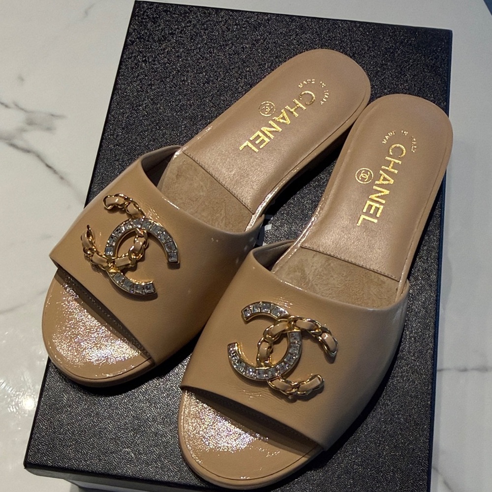 CHANEL Beige Patent Leather Slide Mules with Gold Crystal CC